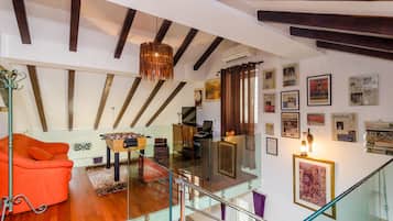 Apartment (Four Bedroom Duplex Apartment) | Living room | 25-inch flat-screen TV with cable channels, TV, DVD player