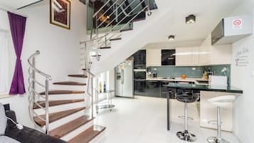 Apartment (Four Bedroom Duplex Apartment) | Living room | 25-inch flat-screen TV with cable channels, TV, DVD player