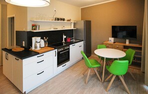 Fridge, stovetop, dishwasher, coffee/tea maker