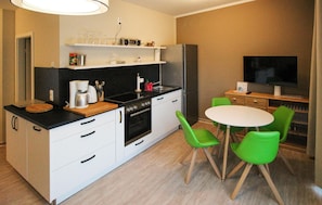 Fridge, stovetop, dishwasher, coffee/tea maker