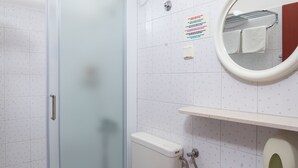 A bathroom with a glass shower enclosure, a toilet, a sink, and a mirror. - Villa Konalić - Double or Twin Room with Balcony and Sea View 1 (Mokosica)