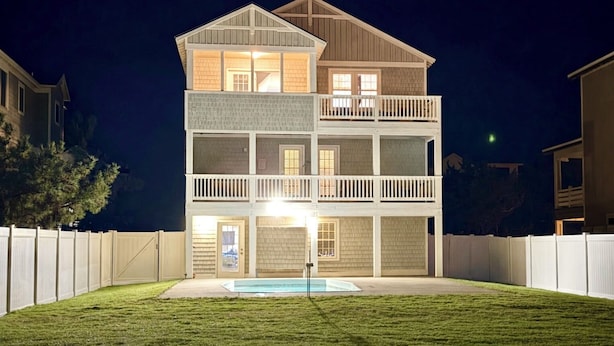 A two-story building with a front deck and a swimming pool. - N3325-Oceanside, Nags Head, Saturday Check In, Private Pool! (Nags Head)