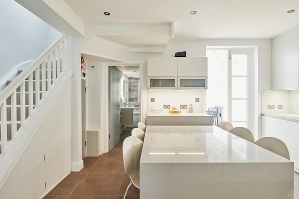 Enjoy meals and gatherings in this well-equipped kitchen with a central island and dining area.
