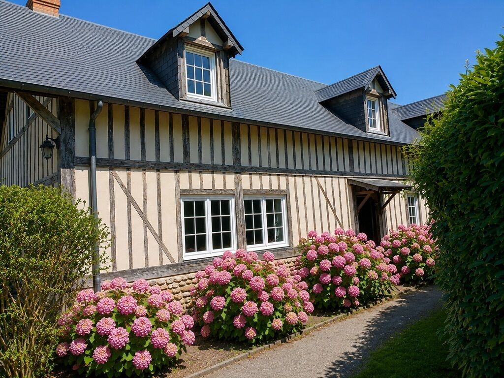 A traditional half-timbered house with a steeply pitched roof, a chimney, and a front entrance.