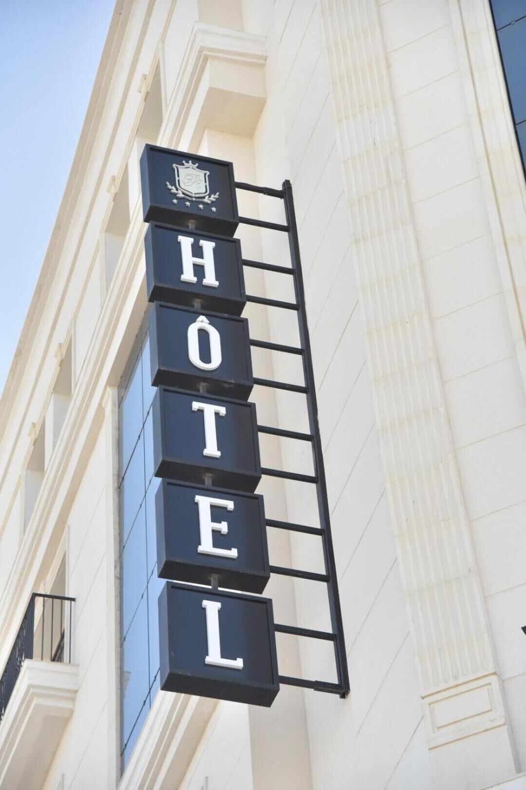 A hotel sign with the word "HOTEL" in large, bold letters.