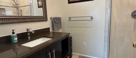 Shower, hair dryer, towels, soap