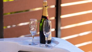 A hot tub with two glasses and a bottle of champagne. - Maria's Place, a great place to experience Crete! (Rethymno)