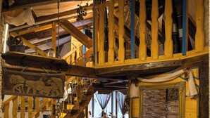 A rustic wooden interior with a staircase, rustic decor, and a dining area. - Lazuština Paradise - Holiday Home with Swimming Pool (Gruda)