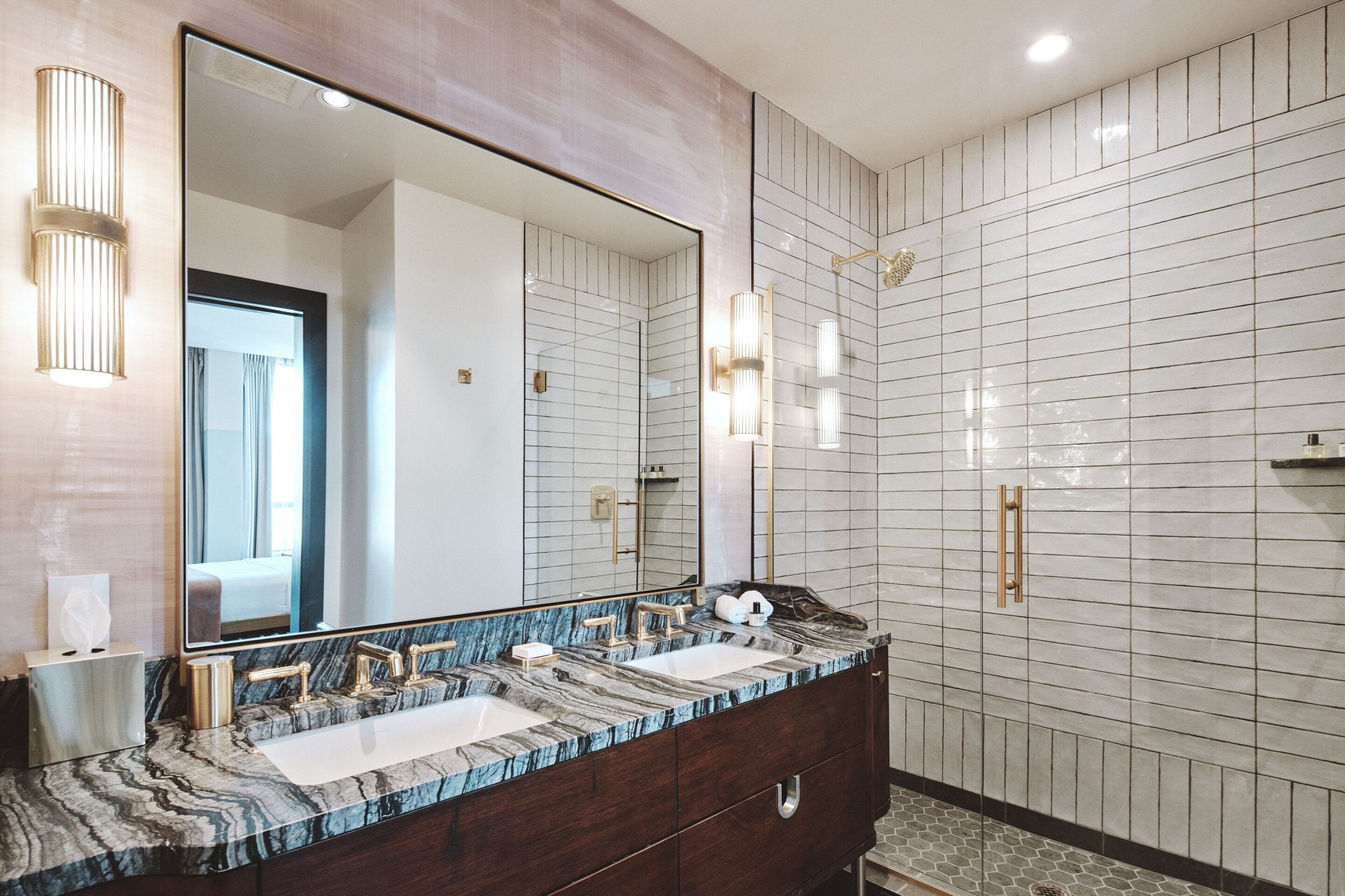 luxury room | bathroom | rainfall showerhead, designer toiletries, hair dryer, bathrobes