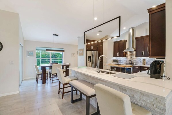 House (124 SE 28th Ter) | Private kitchen | Dining tables