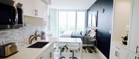 Fridge, microwave, dishwasher, cookware/dishes/utensils