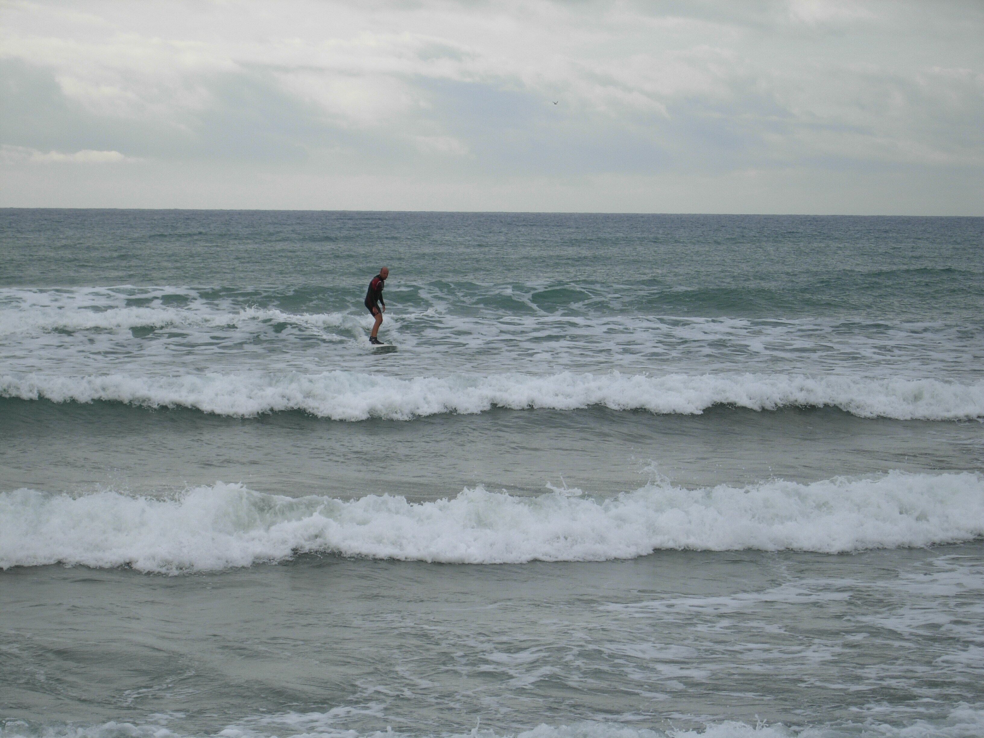 A person surfing in the ocean.