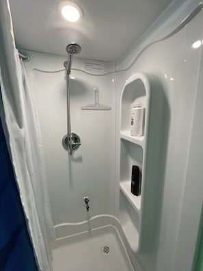Combined shower/bathtub, hair dryer, towels, soap