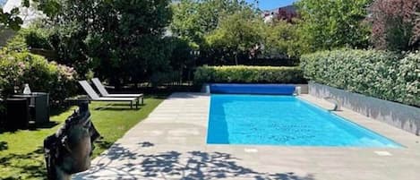 Outdoor pool, a heated pool, pool loungers