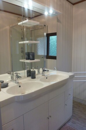 Shower, hair dryer, towels, toilet paper