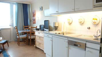 Fridge, coffee/tea maker, toaster, cookware/dishes/utensils