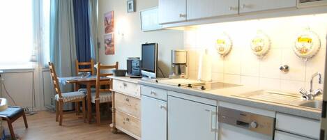 Fridge, coffee/tea maker, toaster, cookware/dishes/utensils