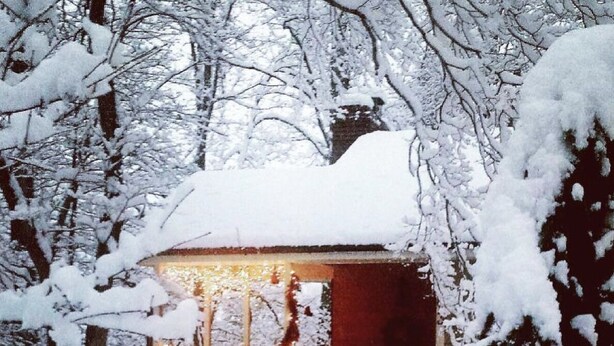 A snow-covered cabin with a visible entrance and a small porch area. - Relaxing Stay in Black Mountain, NC (Black Mountain)