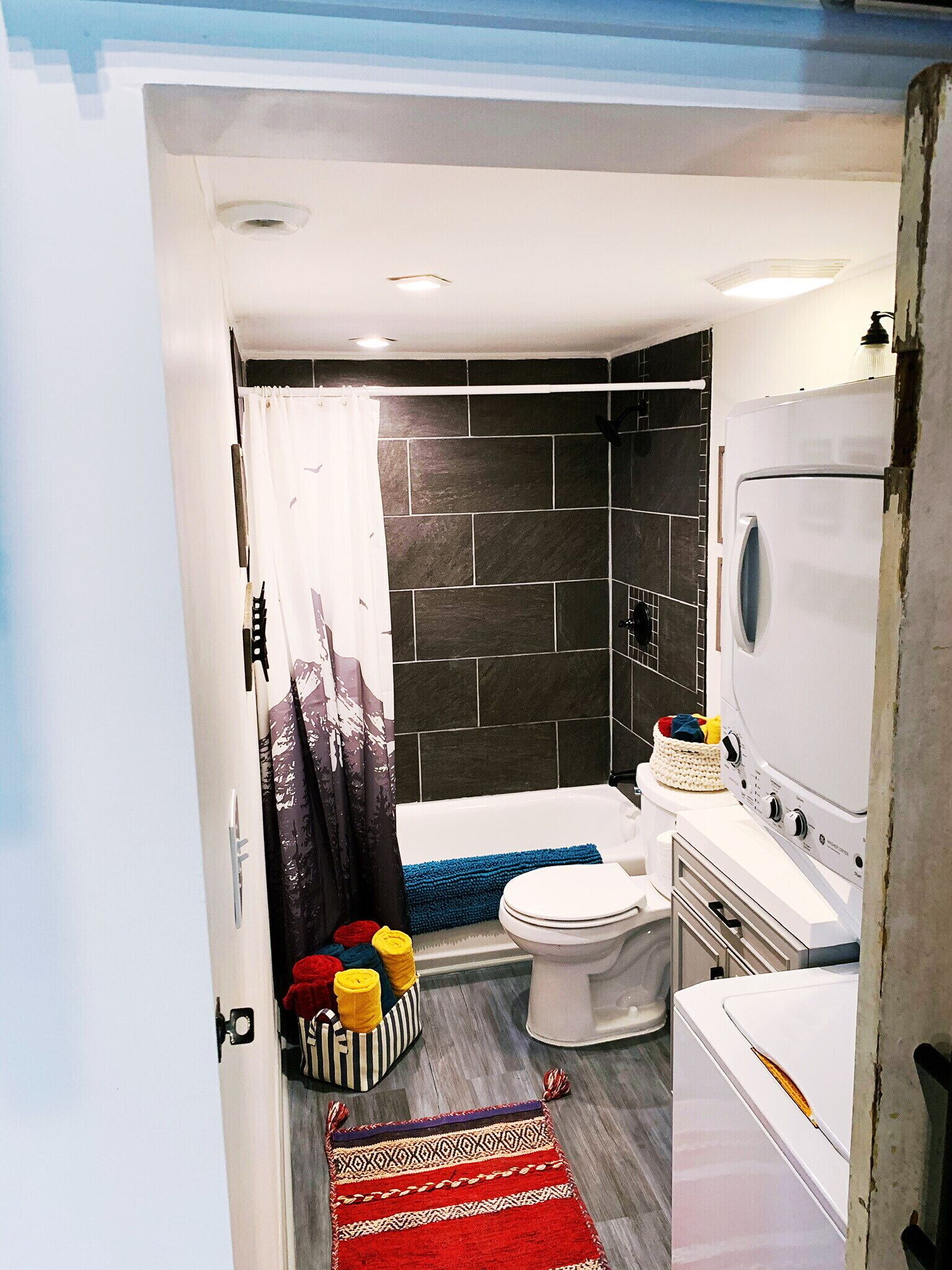 Combined shower/tub, hair dryer, towels, soap