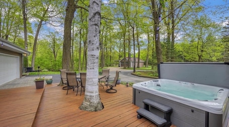 Terrace/patio. Beautiful private home hidden in the woods. Can sleep 11 guests