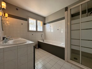 Combined shower/tub, hair dryer, towels, toilet paper
