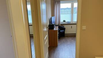 Apartment | Living area | 32-inch flat-screen TV with cable channels, TV, DVD player