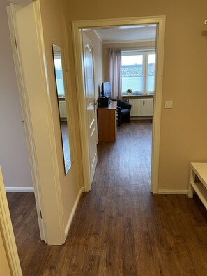 Apartment | Living area | 32-inch flat-screen TV with cable channels, TV, DVD player - Airport Hotel One (Sylt)