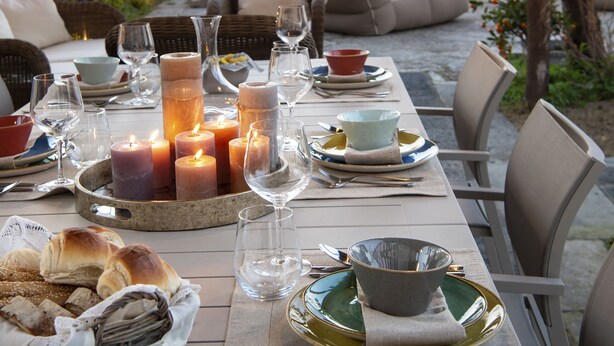 An outdoor dining area with a table set for a meal, overlooking a scenic view. - Villa Galidia with Jacuzzi, Sea View, Garden and Air Conditioning (Sorrento)