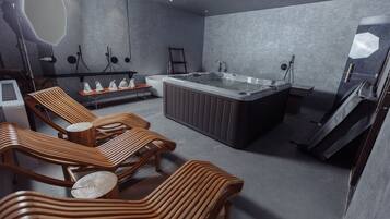 Relax in a serene bathroom with a bathtub, wooden bench, and sleek sink area.
