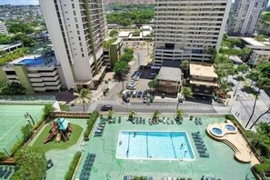 Enjoy a refreshing swim in the rooftop pool with a central water slide and wave pool.