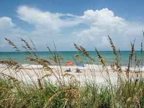 On the beach, sun-loungers, beach towels