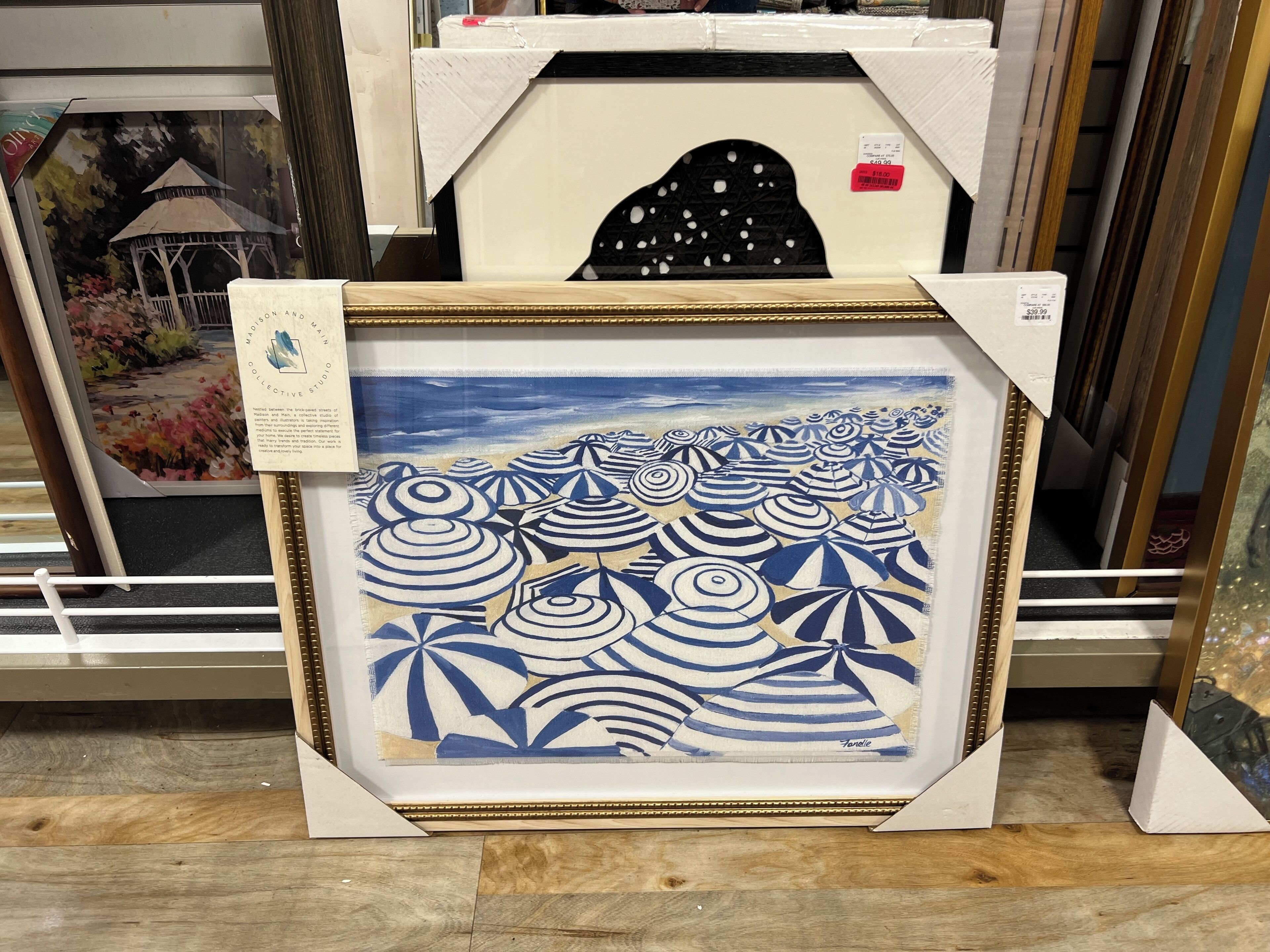 A framed artwork with a coastal scene, priced at $39.99.