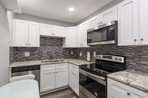 Comfort Apartment | Private kitchen | Full-size fridge, microwave, oven, stovetop - Waters Avenue Unit B (Tampa)
