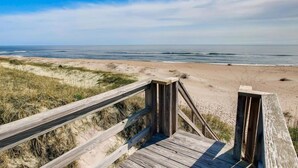 A wooden boardwalk leading to a beach with dunes and ocean views. - Semi-Oceanfront Dog Friendly w/ Pool, Hot Tub, Game Room, Theater, Tiki Bar (Waves)