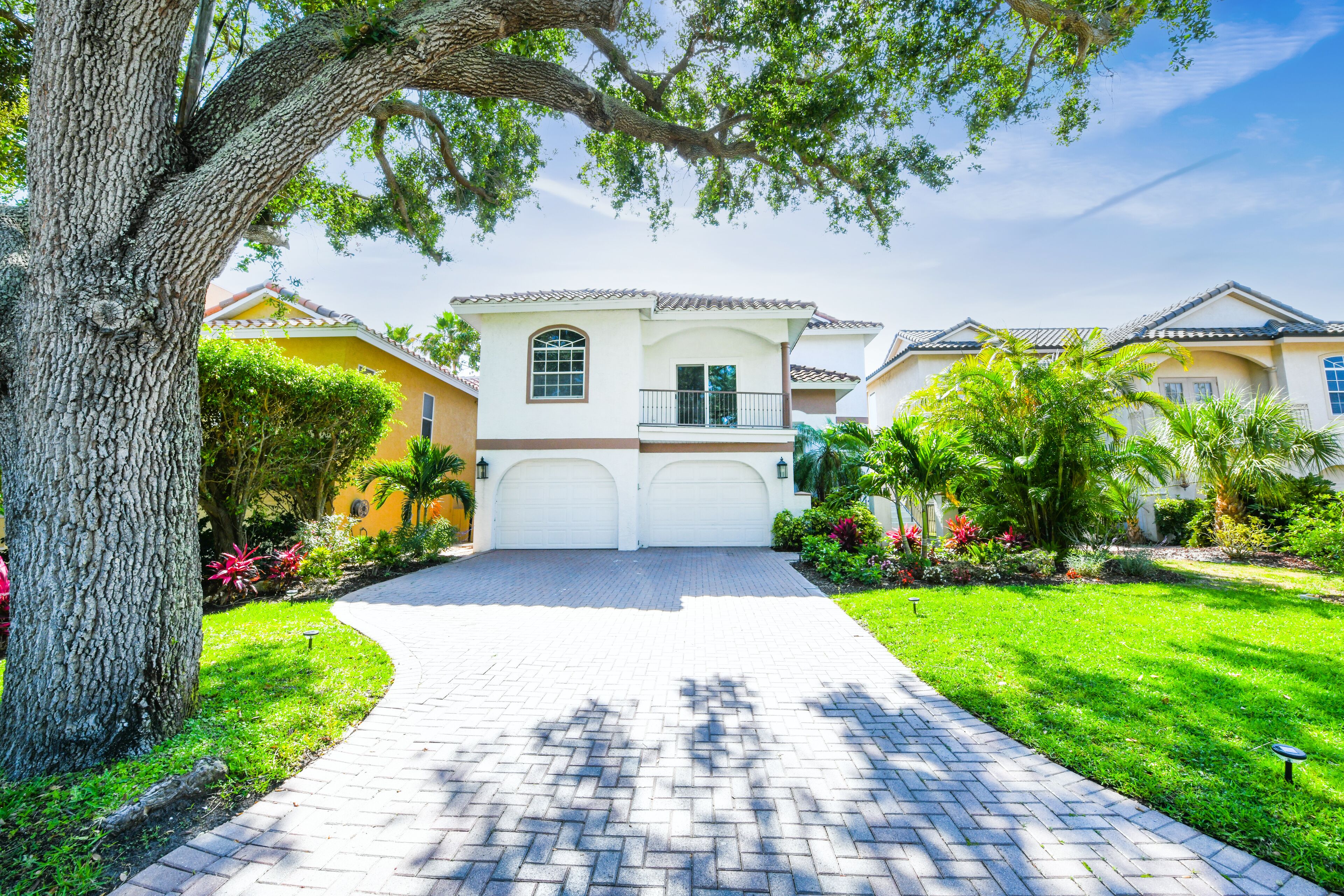 In addition to one available garage space,  driveway accommodates 3 cars.