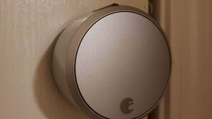 A door knob with a circular design and a logo.