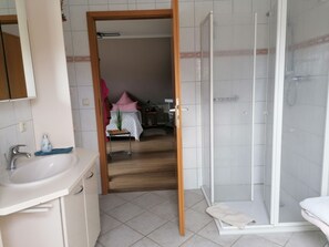 Shower, towels, toilet paper