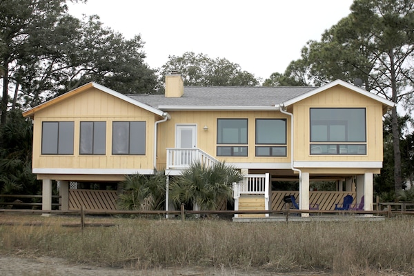 Back of house facing march and ocean.
