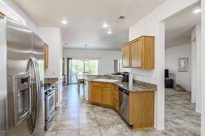 Fridge, microwave, oven, stovetop - Sun City Grand Ranch style house (Surprise)