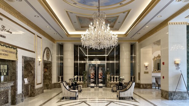 A grand lobby with a chandelier, marble flooring, and seating areas. - Partial Ocean View King STUDIO with Kitchenette and FREE WIFI! (Honolulu)