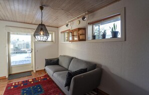 Relax in this inviting living room with a comfortable sofa and a stylish rug.