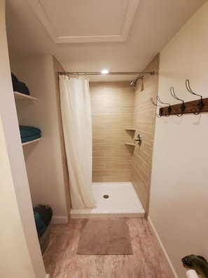 Combined shower/tub, hair dryer, towels, soap