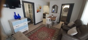 Family Apartment | Living area | 55-inch LCD TV with satellite channels, TV