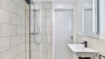 Bathtub, hair dryer, towels
