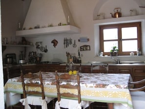 Enjoy meals at the dining table, surrounded by a view of the outdoors.