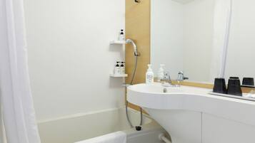 Combined shower/tub, free toiletries, hair dryer, slippers