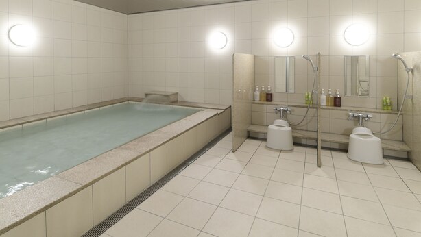 A modern bathroom with a large bathtub, a separate shower area, and a toilet. - First Cabin Kansai Airport (Izumisano)