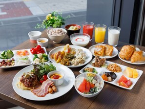 A breakfast buffet with various dishes and beverages. - Granbell Hotel Susukino (Sapporo)