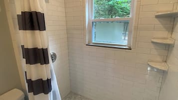 Bathtub, hair dryer, towels