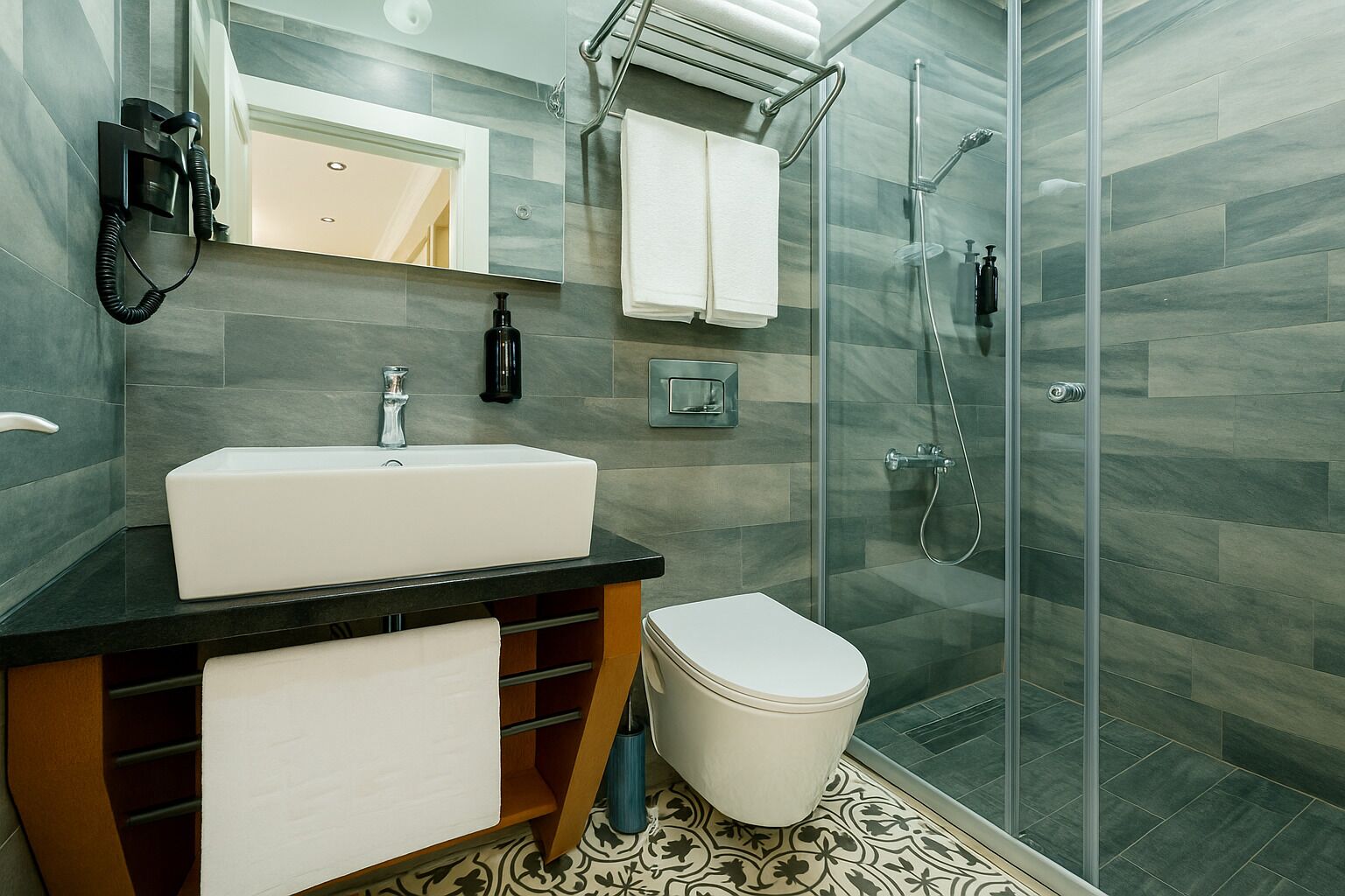 standard double room | bathroom | shower, rainfall showerhead, designer toiletries, hair dryer